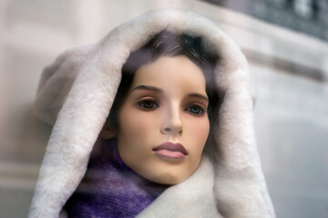 Closeup of  winter coat on mannequin in a fashion store showroom