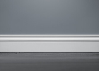 Close up of decorative, moulding white baseboard in empty room with copy space - 478329537