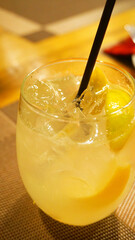 cocktail with lemon on the table in the cafe in the bar refreshing drink