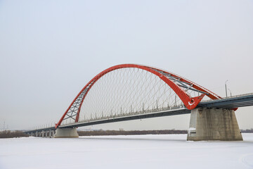 The large red arch bridge in winter close-up