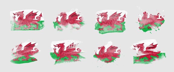 Painted flag of Wales in various brushstroke styles.