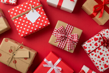 Top view photo of st valentine's day decorations a lot of different gift boxes on isolated red background