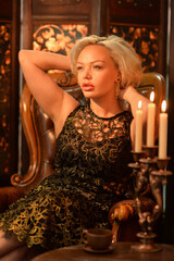 Portrait of young woman posing with candles