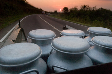 transport of milk jugs at dawn