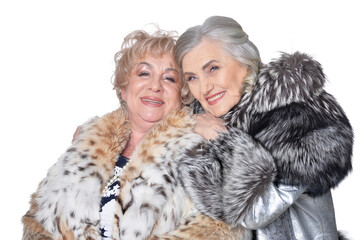 Portrait of senior women in fur coats isolated on white background