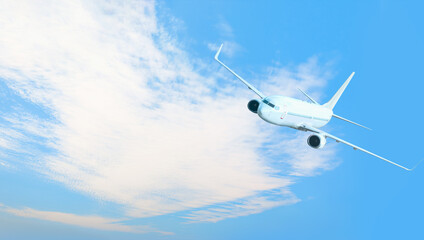 White passenger airplane over the clouds  - Travel by air transport