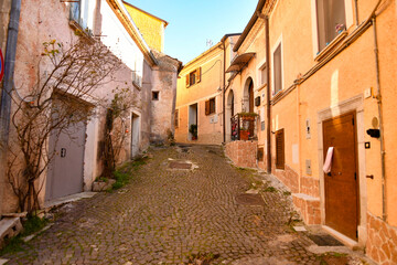 Fototapeta na wymiar A small street between the old houses of Pignola, a small town in the province of Potenza in Basilicata, Italy. 