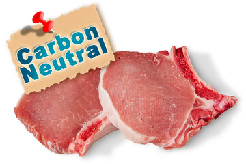 Carbon neutral livestock production - concept with pork steak and Carbon Neutral certification