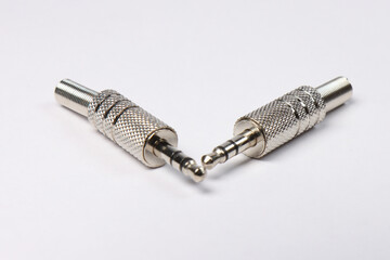 Metal mini Jack 3.5 connectors in silver color on a white background.