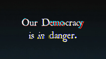 An ominous text message, written with an old typewriter, shaken by intentional glitch and distortion fx: Our Democracy is in danger.
 - obrazy, fototapety, plakaty