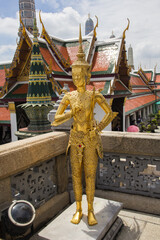 Golden Kinnari statue at Wat Phra Kaew, Bangkok, Thailand