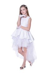 Naklejka premium Happy beautiful little girl in white dress posing on white background
