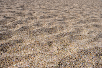 Fototapeta na wymiar Sand background texture. Sandy beach, summer vacation concept