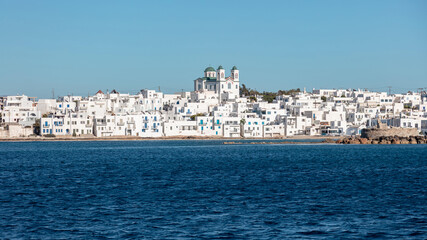 Fototapeta premium Paros island panoramic view of Naoussa village Cyclades Greece. Calm sea blue sky background.