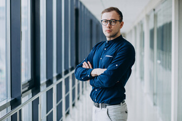 Fototapeta premium Young handsome man at the business center