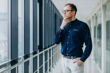 Fototapeta premium Young handsome man at the office center
