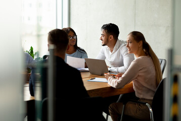 Corporate Lifestyle. Group Of Multiethnic Coworkers Brainstorming On Business Project