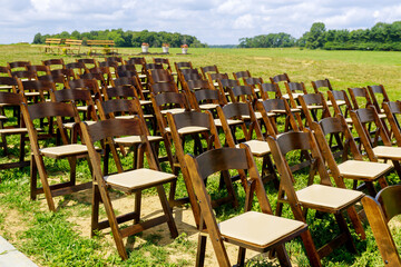 Wedding wooden chairs in rustic countryside style.