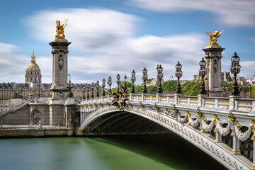 Pont Alexandre III Bridge over the Seine River with view of the Invalides (UNESCO World Heritage Site). 7th Arrondissement, Paris, France