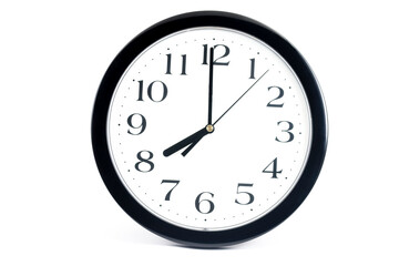 Black classic clock on isolated white background.