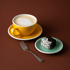Cup of coffee with a cake