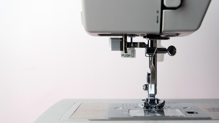Close up of gray sewing machine