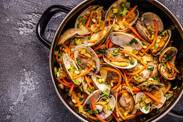 Shells vongole venus clams with vegetables and herbs