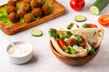 Falafel and fresh vegetables in pita bread