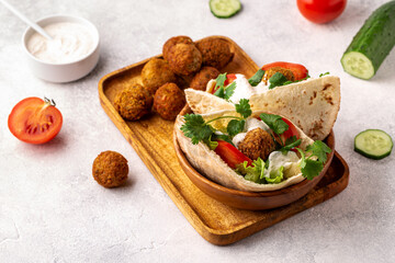 Falafel and fresh vegetables in pita bread