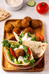 Falafel and fresh vegetables in pita bread