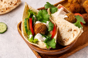 Falafel and fresh vegetables in pita bread