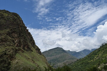 Fototapeta premium clouds and mountains and river
