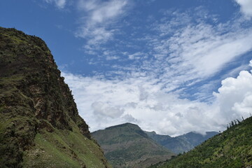 clouds and mountains and river