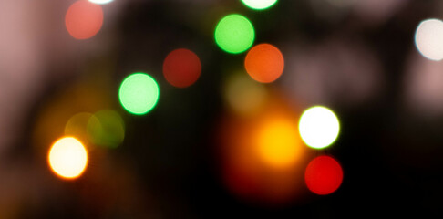 Festive multicolored abstract texture, dark bokeh background