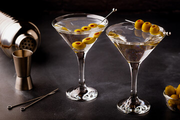 Martini cocktail on dark stone table.