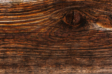 An old board with a knot. Grunge rough texture, wood texture, big knot.