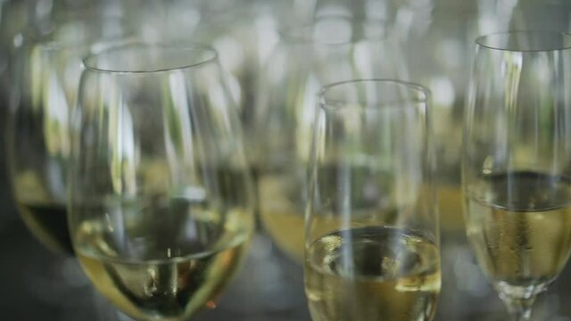glasses with white and red wine camera movement. High quality FullHD footage