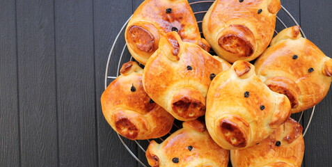 freshly baked golden yellow pretzels with a pig face
