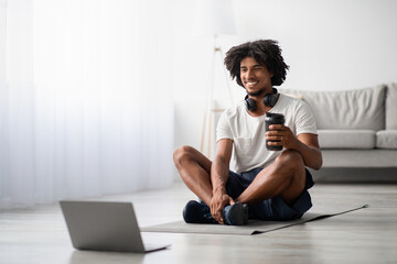 Young Black Guy Training At Home With Online Tutorials On Computer