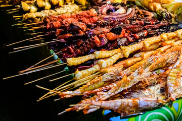 Different seafood for sale at the Forodhani gardens in Stone town at night. Zanzibar, Tanzania