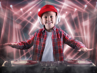 The little boy in the style of Hip-Hop .Cool rap dj. Children's fashion.Cap and jacket. The Young Rapper.	