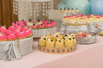 Dessert table for a party. cupcakes, sweetness and fruits