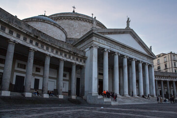 Obraz premium Detail of the colonnade and the Pontifical Royal Basilica of San Francesco da Paola located in Piazza Plebiscito in Naples, Italy.