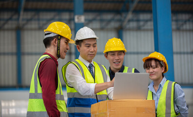  Warehouse worker meeting. Employee asian people using laptop in factory