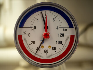 The axial thermomanometer is a combined device for measuring pressure and temperature in heating systems.