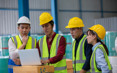 Warehouse worker meeting. Employee asian people using laptop in factory