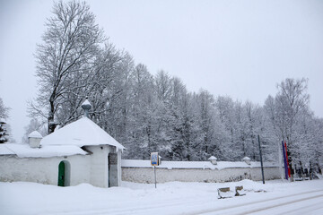 Svyatogorsky Monastery in Pushkin hills, Russia and snow covered trees