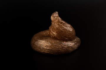 Coral transparent slime with bubbles inside on black background. Kids toy slime.