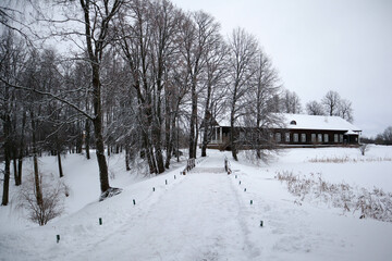 beautiful winter view to Trigorskoye estate wooden main building old house in the snow, Pushkin...