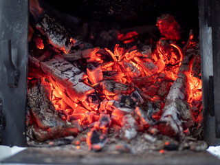 Details of charcoal in the furnace. Burning firewood in the grill.